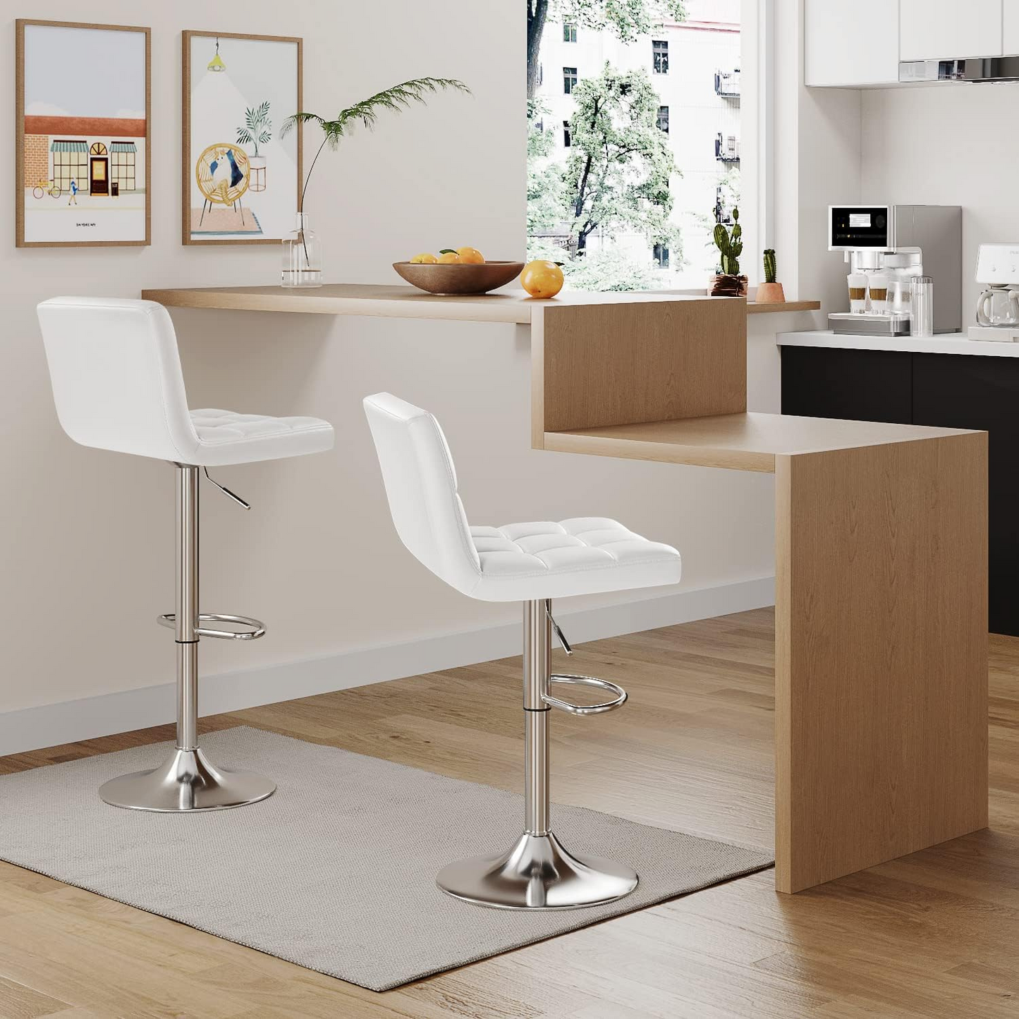 Bar Stool Set of Two with 360 Swivel and Adjustable Height for Kitchen | White Faux Leather from AHF Depot - Two modern white bar stools placed in a modern kitchen setting, positioned next to a multi-level kitchen island showcasing the height adjustability.