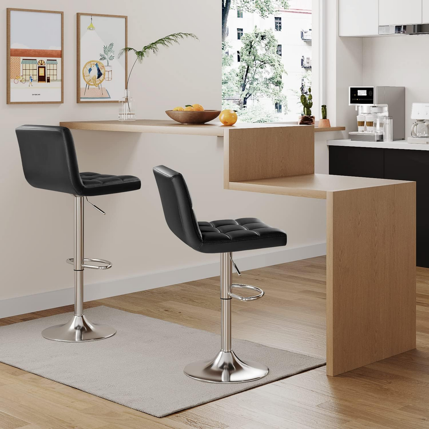 Bar Stool Set of Two with 360 Swivel and Adjustable Height for Kitchen | Black Faux Leather from AHF Depot - Two modern black bar stools placed in a modern kitchen setting, positioned next to a multi-level kitchen island showcasing the height adjustability.