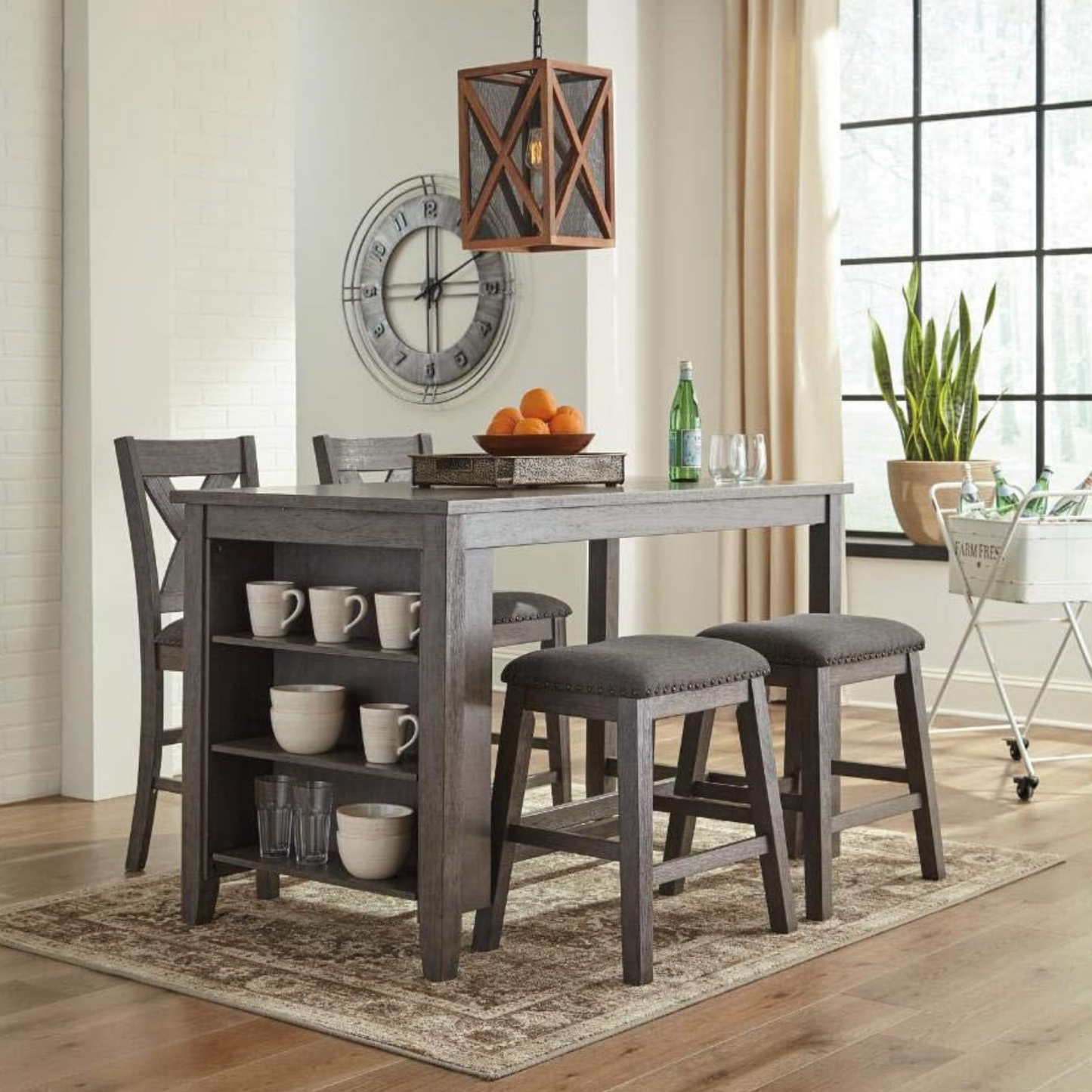 Rustic Counter Height Dining Table with Storage | Dark Oak from AHF Depot - Dining table with chairs and stools featuring a dark gray wash design and built-in shelving, placed in a modern kitchen below a single hanging lantern modern light fixture. (SEATS NOT INCLUDED)