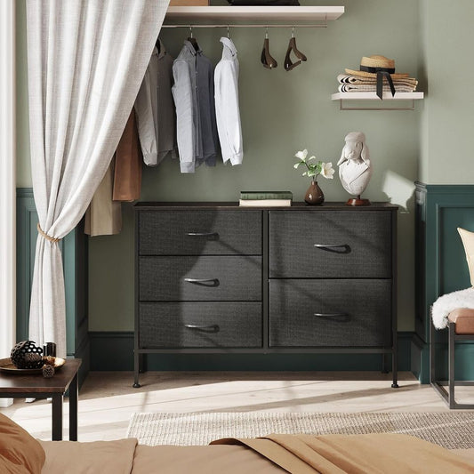 Dresser with 5 Drawers for Bedroom | Redesigned Black from AHF Depot - Black 5 drawer dresser in a modern bedroom setting against a green wall.