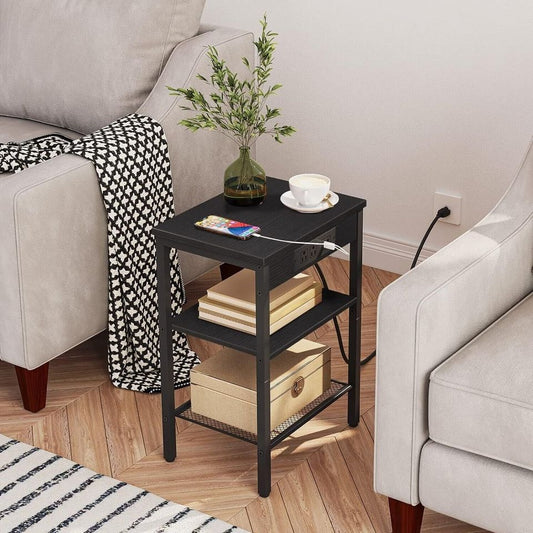 Side Table/End Table with Charging Station for Bedroom Storage | Black from AHF Depot - Black side table with charging station in a modern light tone living room setting plugged in against a white wall.