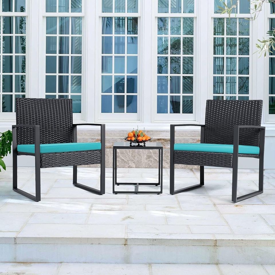 Outdoor Patio Chairs and Table Set | Black/Teal from AHF Depot - Modern black frame patio conversation set with teal blue cushions and small glass top table, set against a sunny outdoor patio setting.