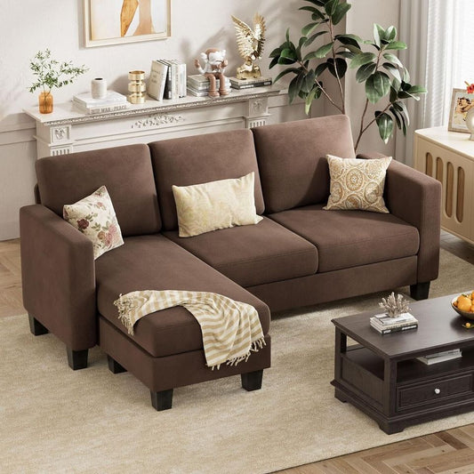 Couch Sectional Sofa with Ottoman for Living Room | Brown from AHF Depot - Brown sectional sofa with a right-side chaise, complementing a light tone modern living room scene placed in front of a fireplace.