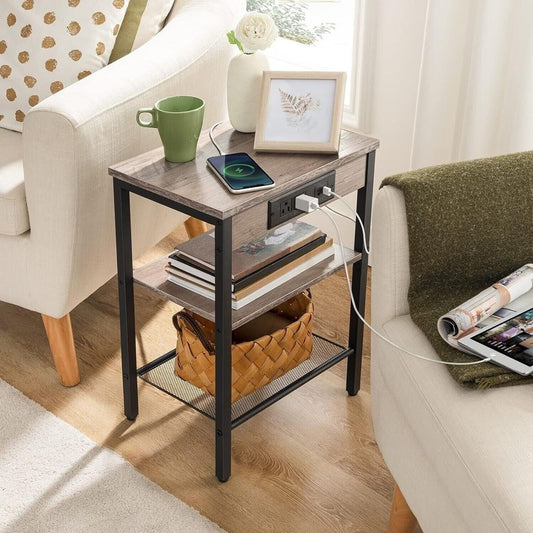 Side Table/End Table with Charging Station for Bedroom Storage | Light Wood from AHF Depot - Light wood side table with charging station in a modern light tone living room setting plugged in between two chairs.