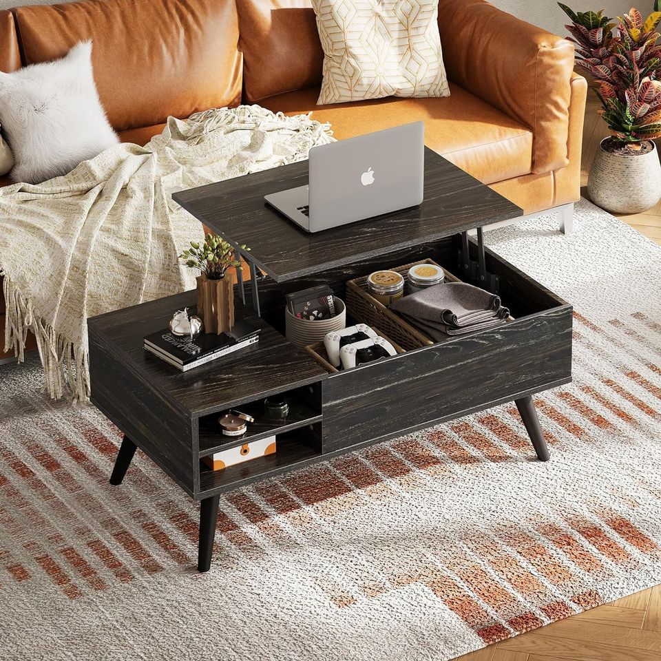 Coffee Table with Lifting Top and Hidden Storage for Living Room | Black Wood Pattern from AHF Depot - Modern living room scene featuring a black wooden coffee table with a lift top in the open position. Placed in front of a stylish couch and a plant.