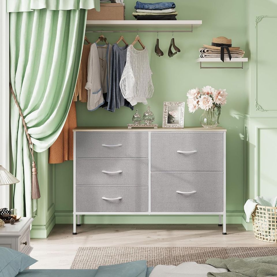 Dresser with 5 Drawers for Bedroom | Redesigned Light Grey from AHF Depot - Light Grey 5 drawer dresser in a modern bedroom setting against a light green wall.