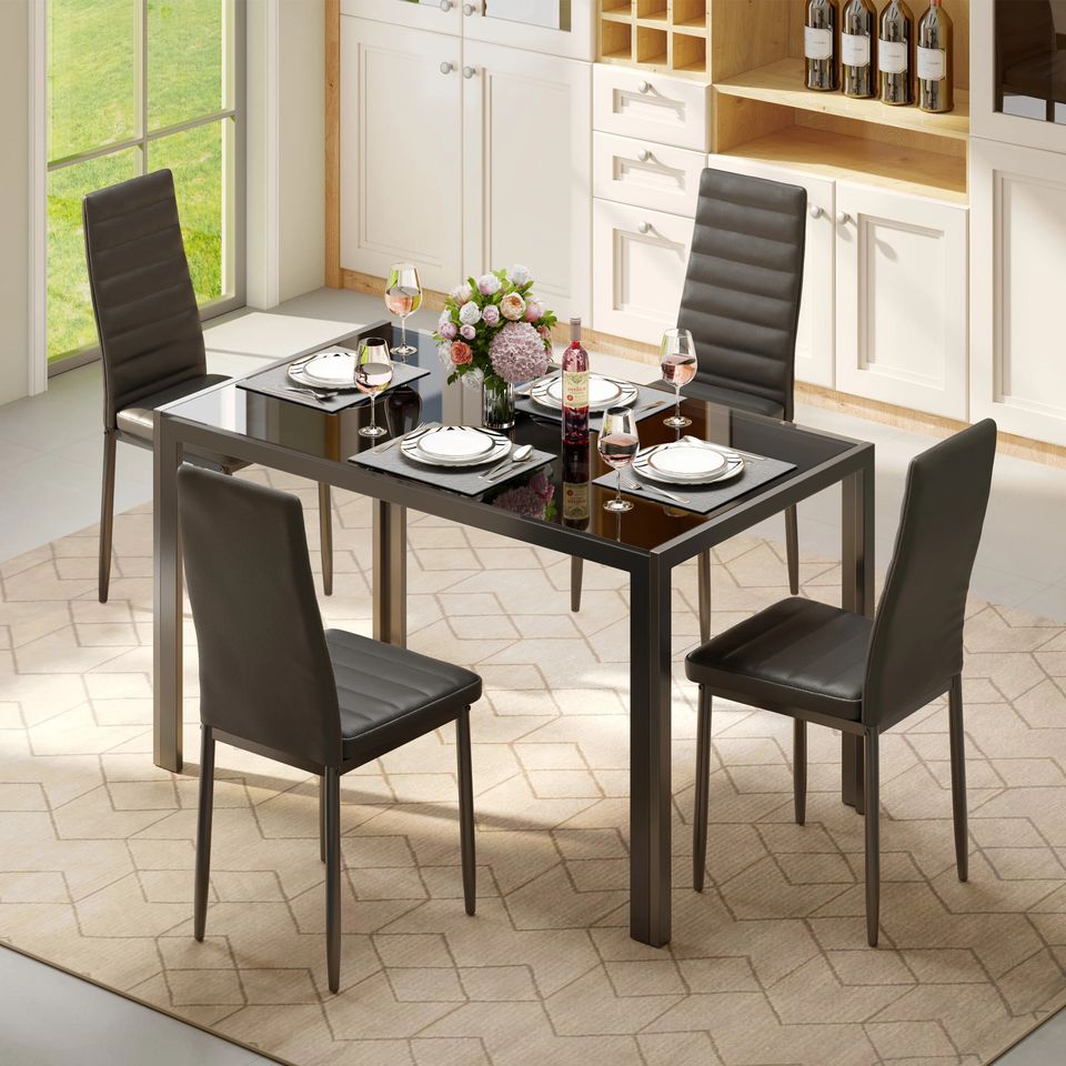 Dining Set Includes Table and Chairs for Kitchen | Black from AHF Depot - Modern black dining table with four chairs, set with dishes and wine in a stylish indoor dining room scene.