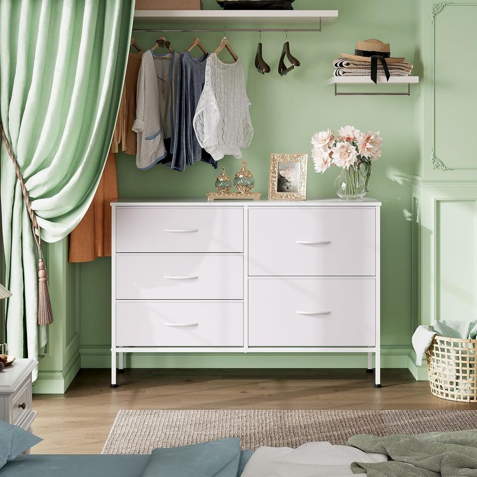 Dresser with 5 Drawers for Bedroom | Redesigned White from AHF Depot - White 5 drawer dresser in a modern bedroom setting against a light green wall.