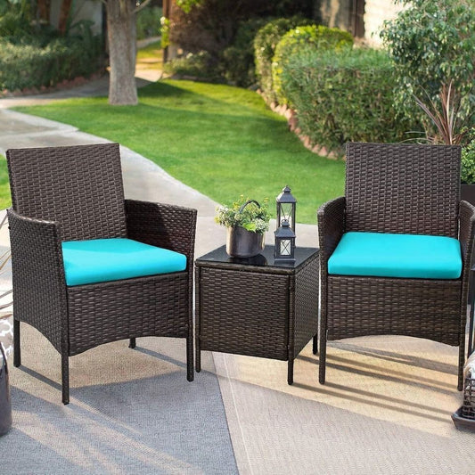 Outdoor Patio Chairs and Table Set | Brown/Teal from AHF Depot - Modern brown rattan frame patio conversation set with teal blue cushions and small glass top table, set against a sunny outdoor patio setting.