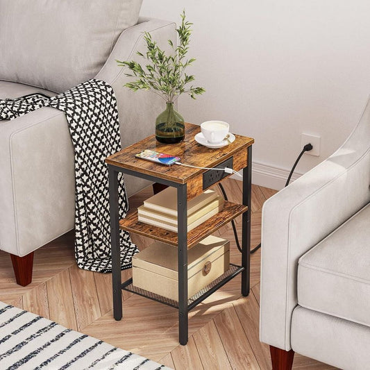 Side Table/End Table with Charging Station for Bedroom Storage | Wood Pattern from AHF Depot - Wood pattern side table with charging station in a modern light tone living room setting plugged in between two chairs.