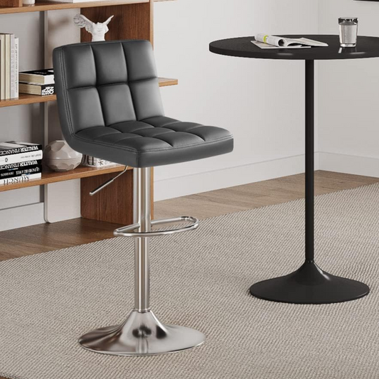 Bar Stool Set of Two with 360 Swivel and Adjustable Height for Kitchen | Grey Faux Leather from AHF Depot - Single grey bar stool placed in a modern setting with light-colored decor, standing in front of a bookshelf.