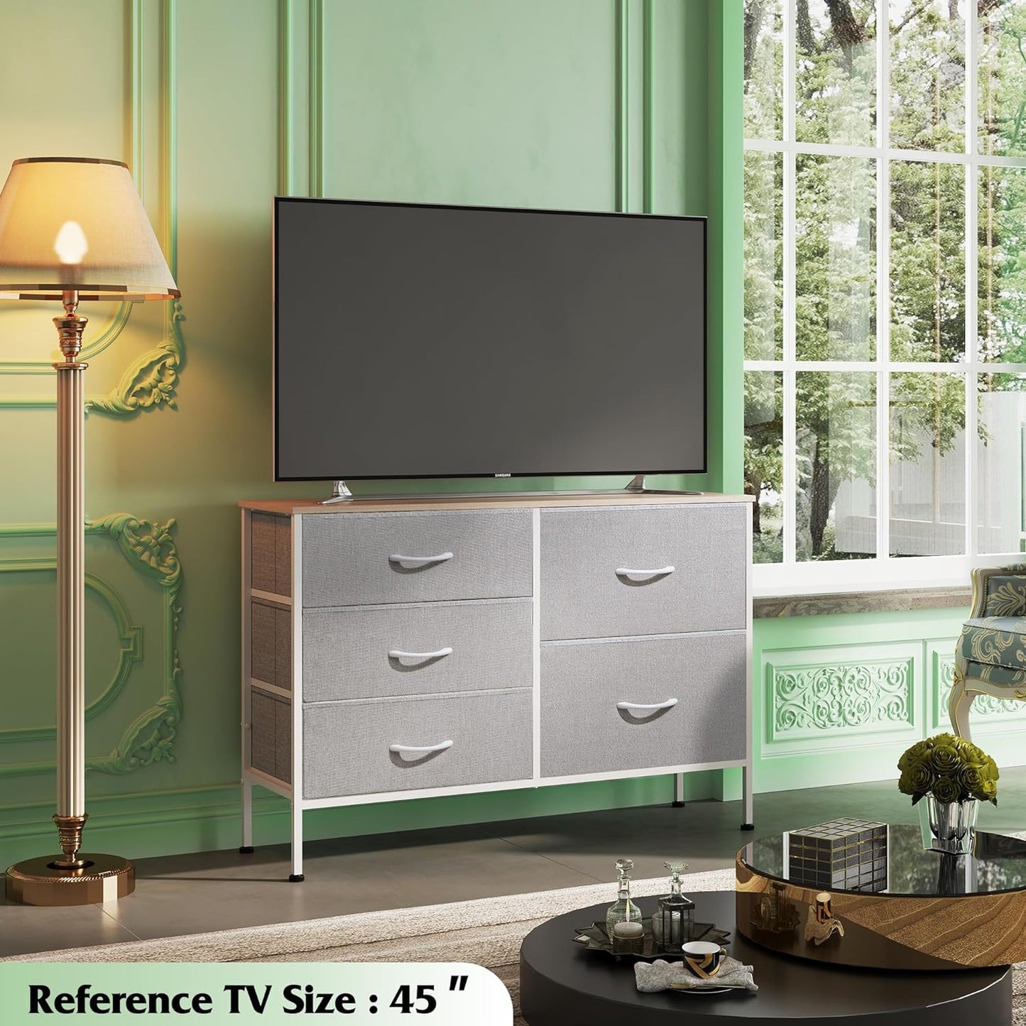 Dresser with 5 Drawers for Bedroom | Redesigned Light Grey from AHF Depot - Light Grey 5 drawer dresser in a modern bedroom setting against a light green wall with a tv on the dresser.