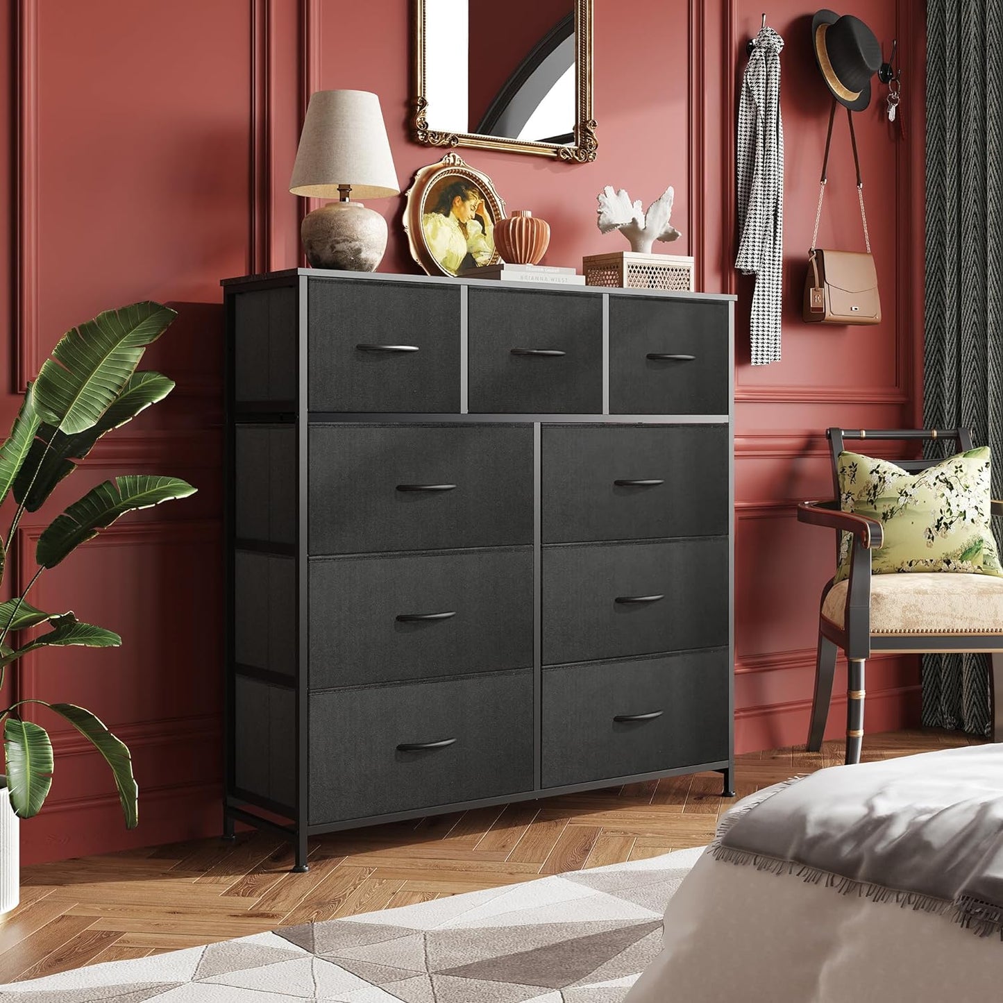 Dresser with 9 Drawers for Bedroom | Black from AHF Depot - Black 9 drawer dresser in a modern light tone bedroom setting against a deep red wall.