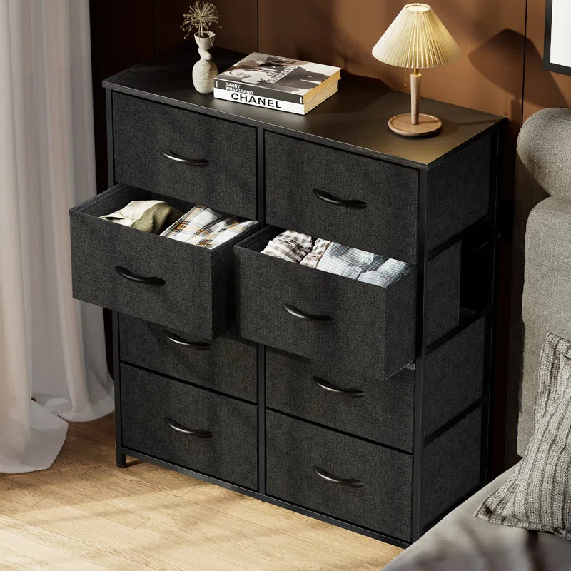 Dresser with 8 Drawers for Bedroom | Black from AHF Depot - Black 8 drawer dresser in a modern light tone bedroom setting with two drawers open against a brown wall.