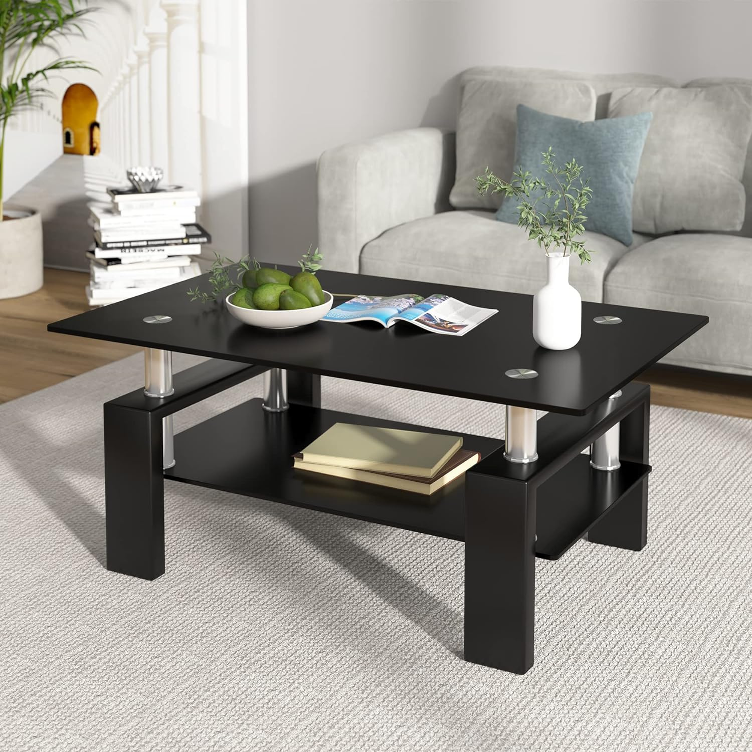 Coffee Table with Stained Glass Top for Living Room | Black from AHF Depot - Modern living room scene featuring a sleek black metal-framed coffee table with a stained glass top. Positioned in front of a stylish couch and a plant.