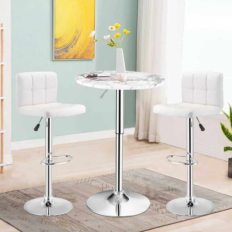 Bar Table Round with Adjustable Height and Swivel | White from AHF Depot - Modern white marble top bar table with a sleek silver frame, situated between two bar stools, in a stylish light-toned living room scene.