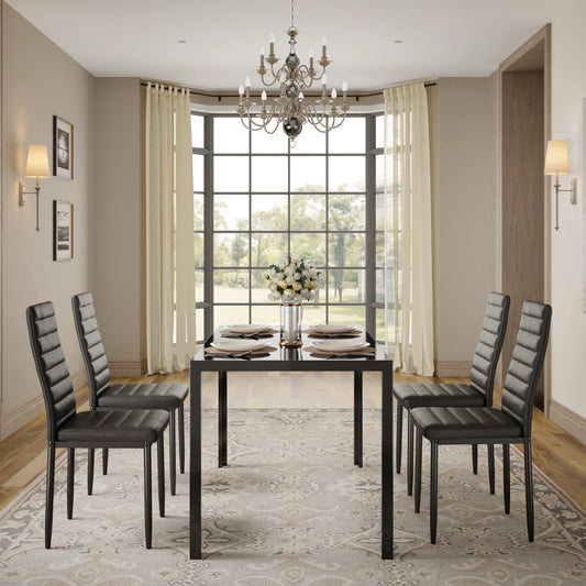 Dining Set with Table and Chairs for Kitchen | Black from AHF Depot - Modern black dining table with four chairs, adorned with plates and a floral center piece, set in a contemporary dining room with a big bay window offering a view of the yard.