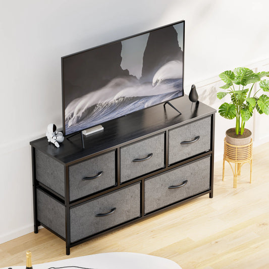 Dresser with 5 Drawers for Bedroom | Grey from AHF Depot - Grey 5 drawer dresser in a modern light tone bedroom setting with a tv on the dresser.